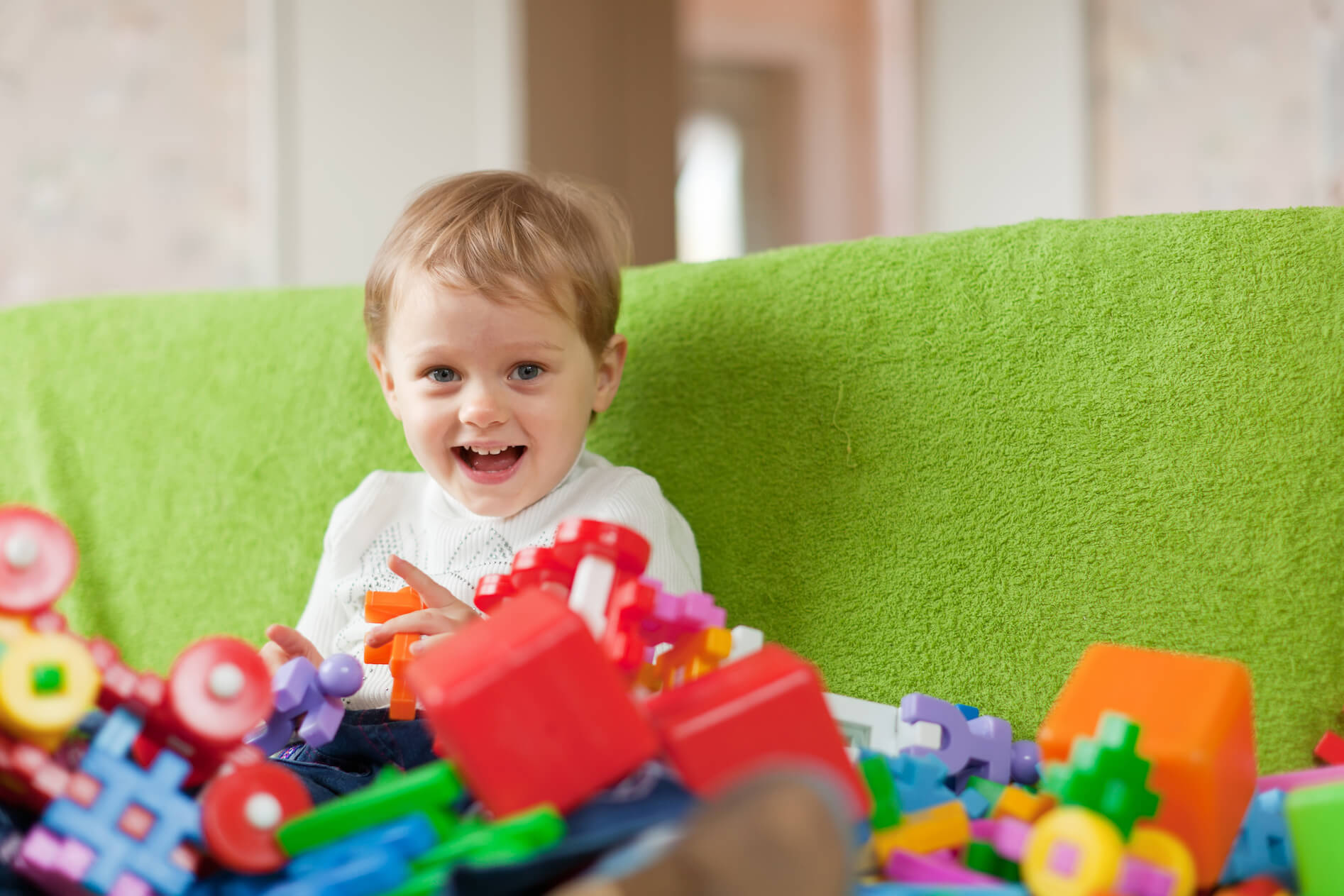 kid behind toys