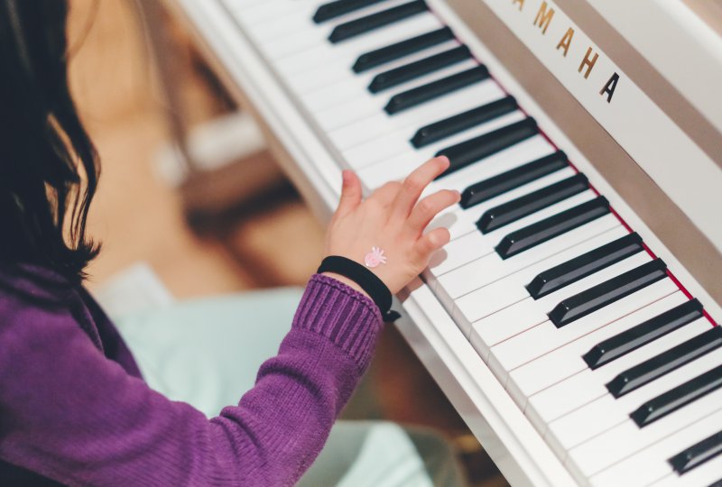 girl playing the piano
